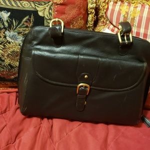 Gently used leather latico laptop bag.